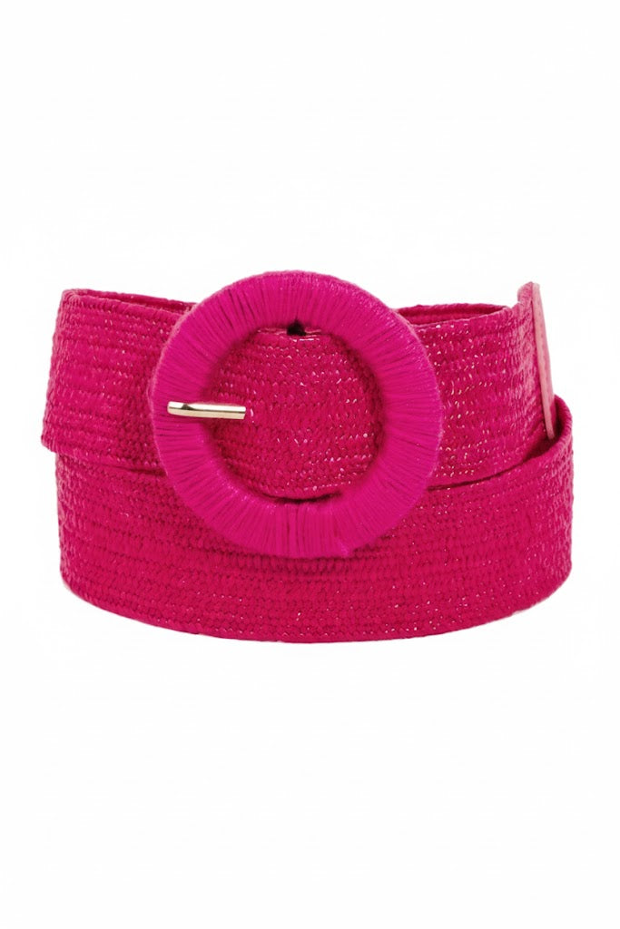 Pink belt with a round buckle on a white background