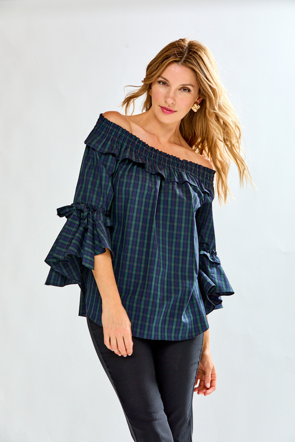 Woman in plaid on/off shoulder top
