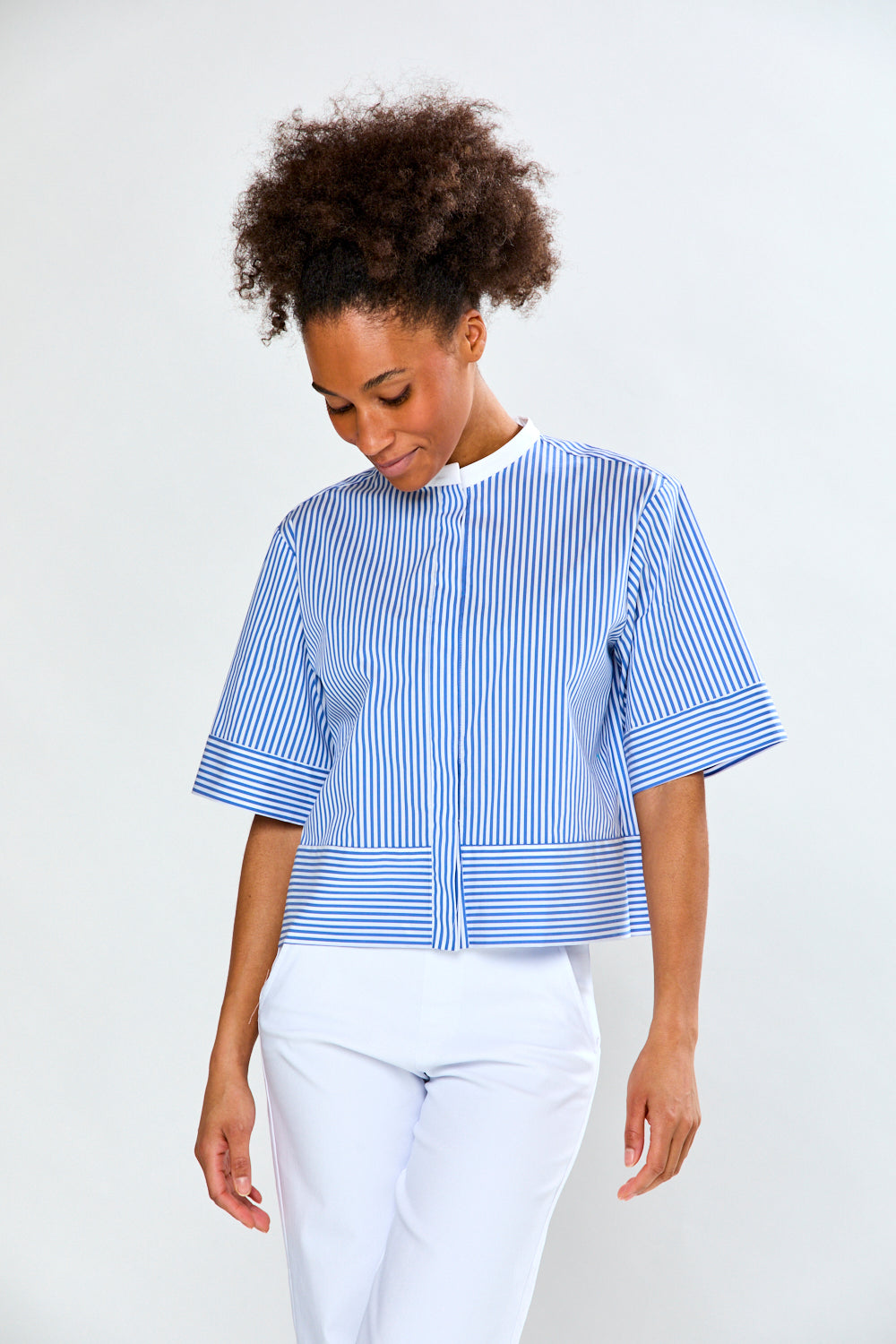 Woman in blue and white striped blouse