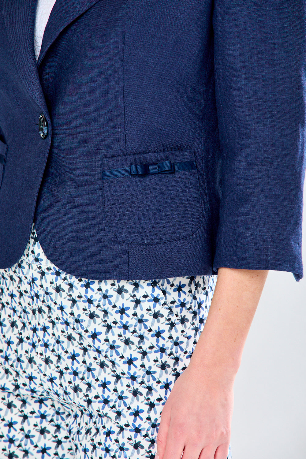 Woman in navy linen jacket