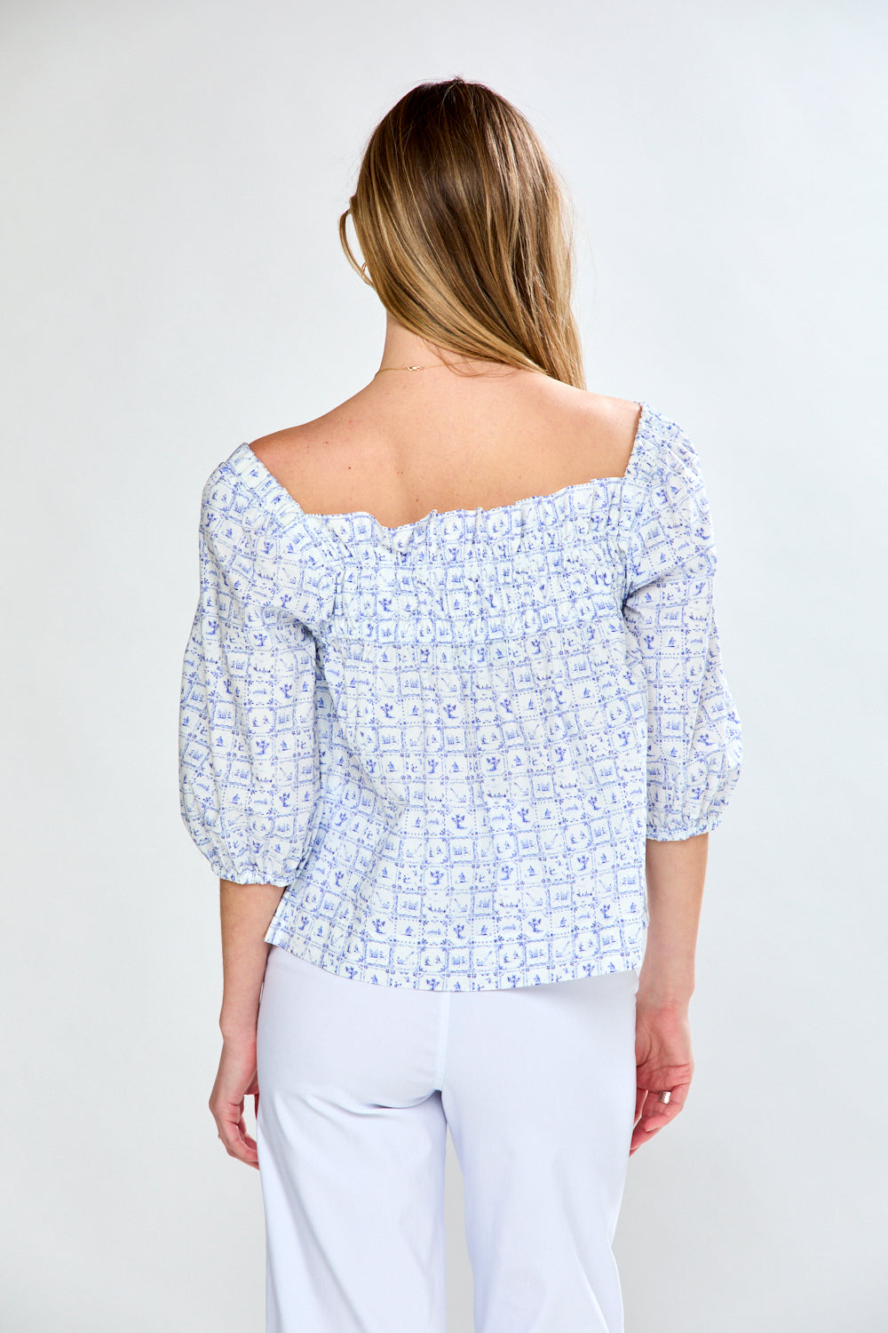 Woman in printed blue top