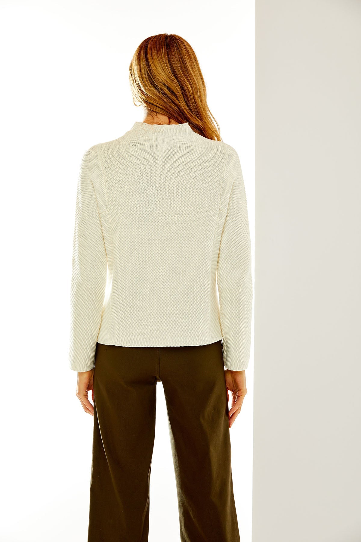 Woman in off-white sweater