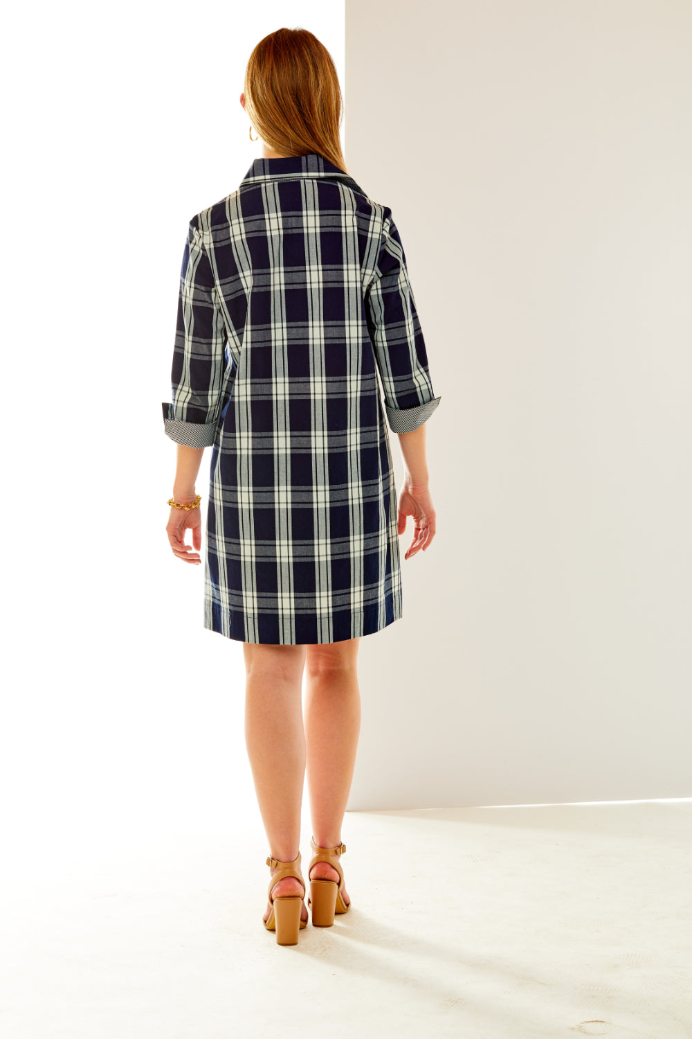 Woman in plaid dress