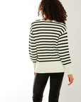 Woman in black and white striped sweater