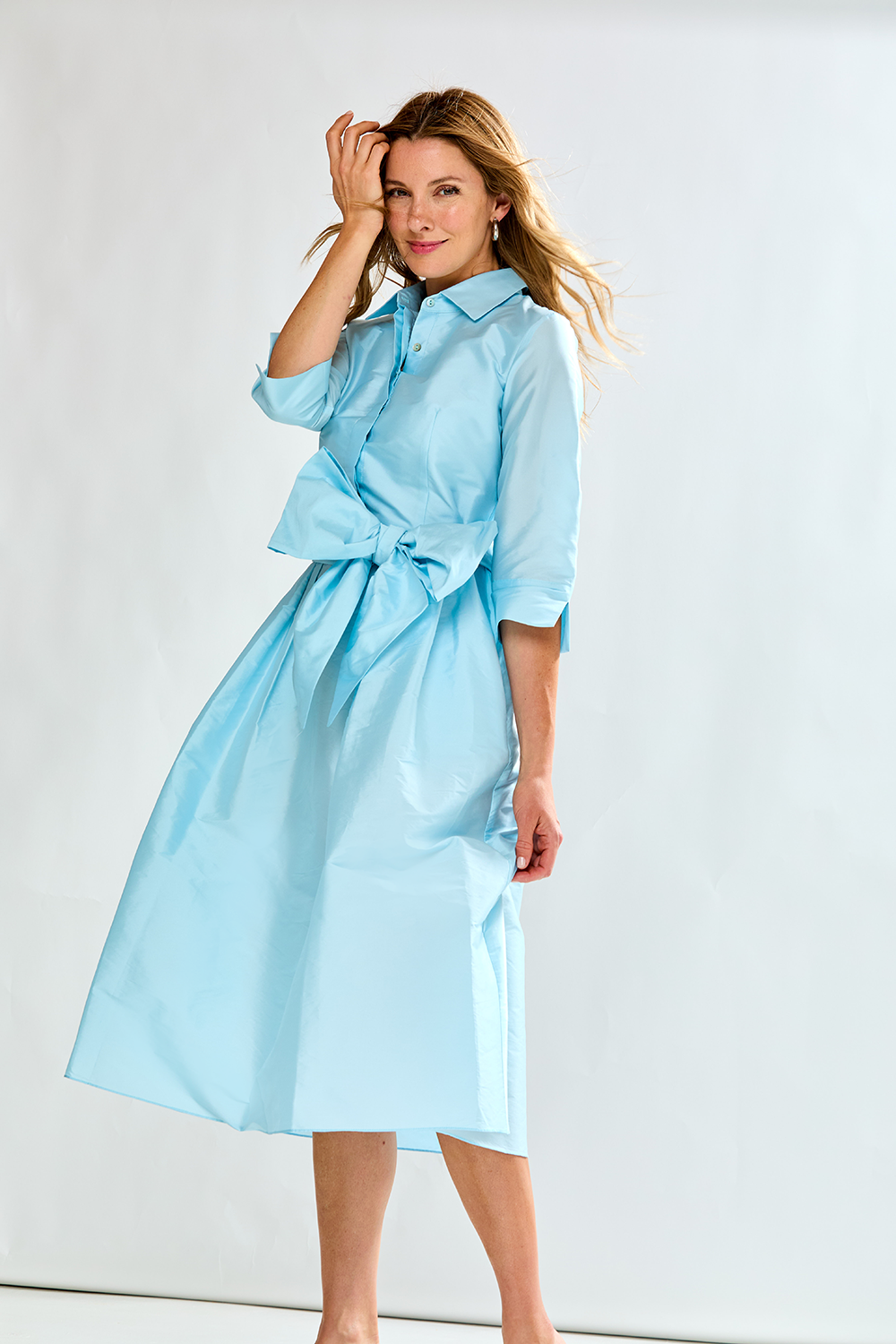 Woman in french blue taffeta dress