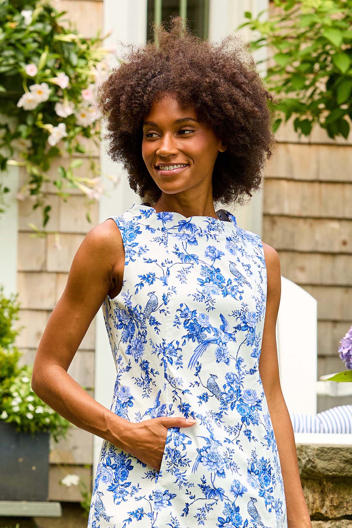 Woman in blue floral print dress