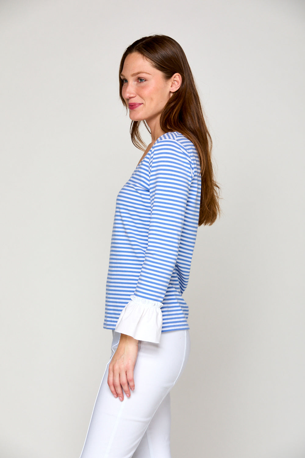 Woman in blue and white stripe top