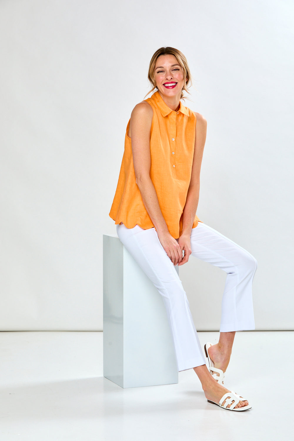 Woman in mandarin sleeveless blouse