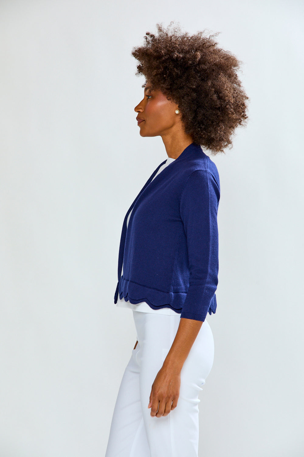 Woman wearing The New Scallop Cardigan - Navy