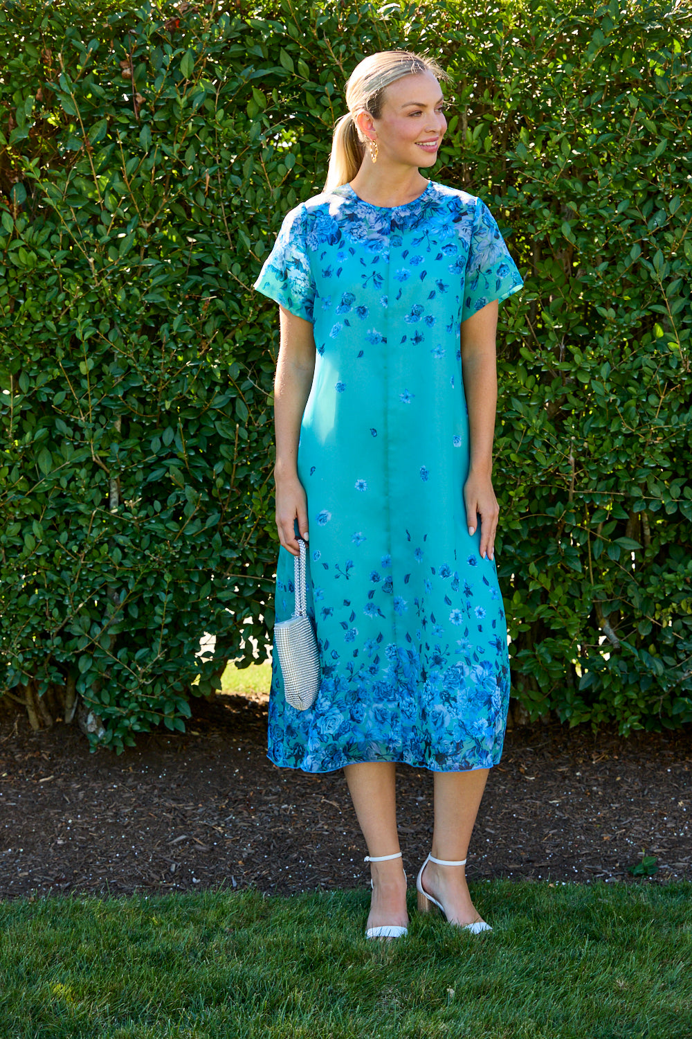 Woman wearing a blue floral dress 