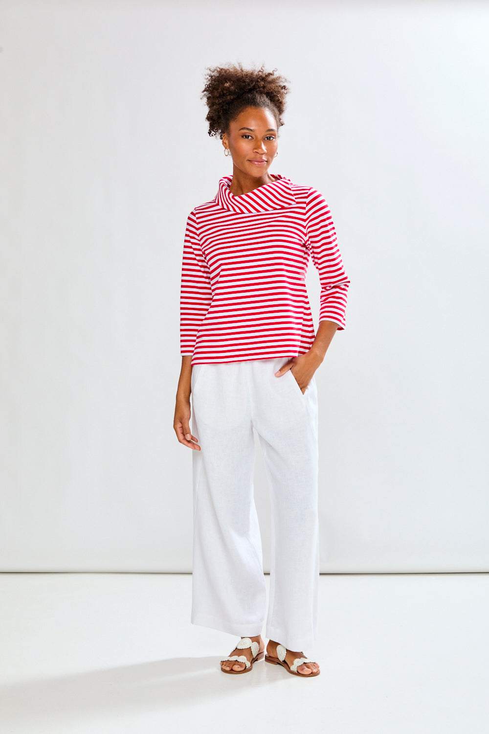 Woman in white linen pants