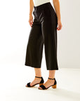 Woman in black cropped pants