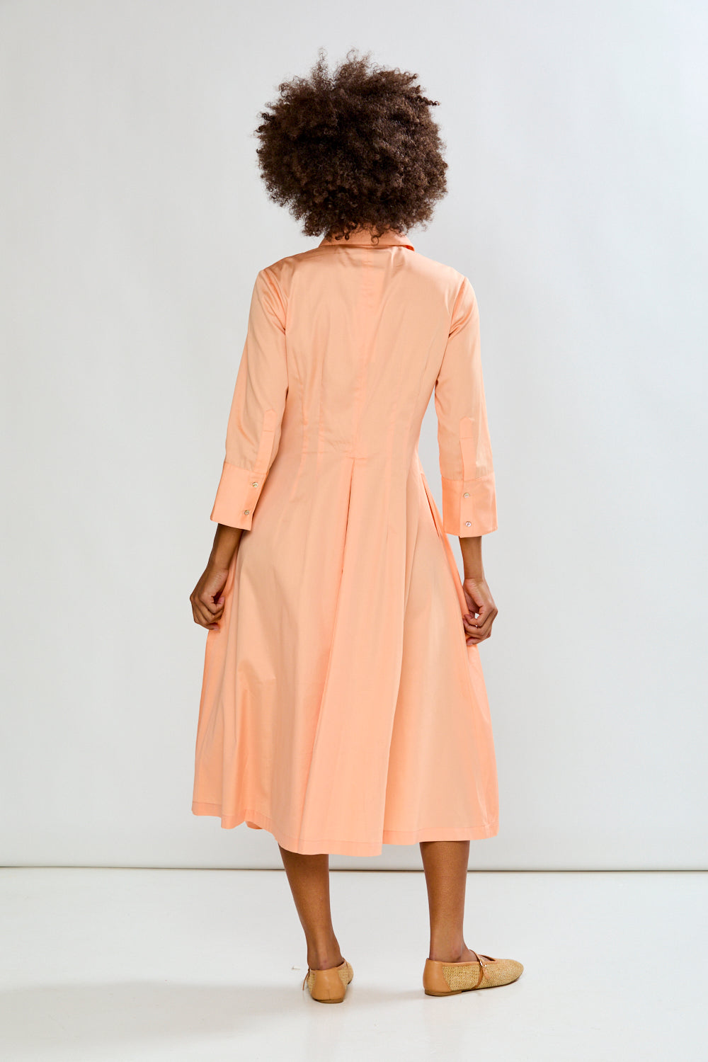 Woman in peach dress