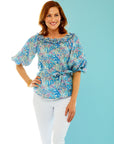 Woman in floral print blouse
