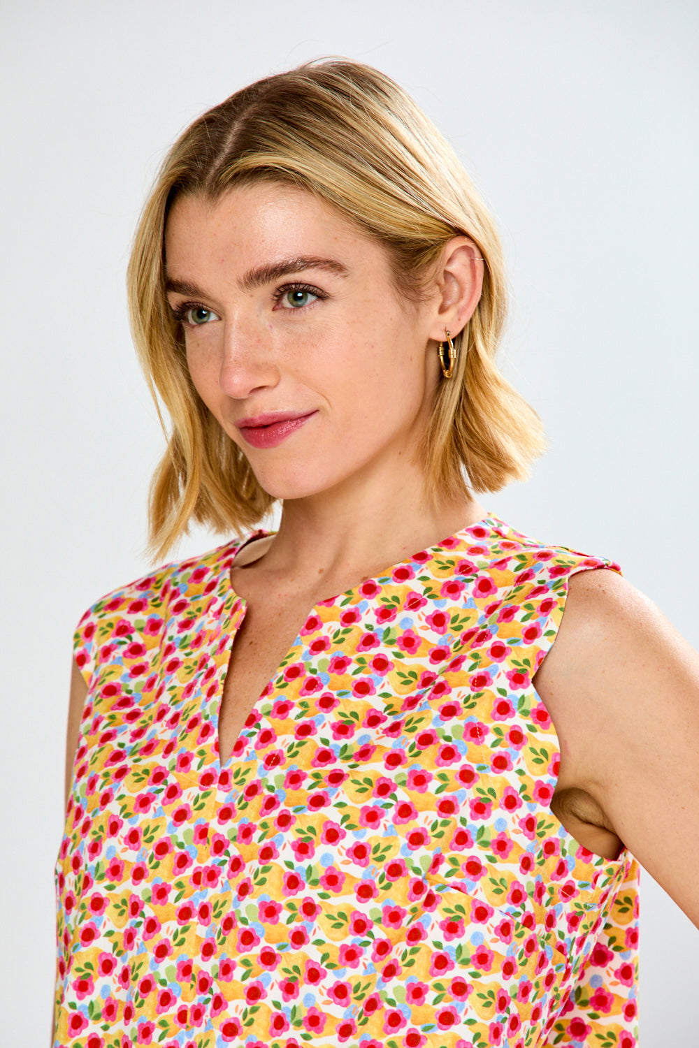 woman in pink floral blouse