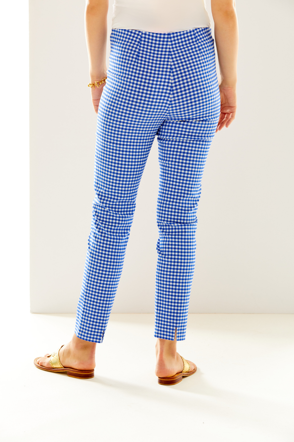 Woman in blue and white gingham pant