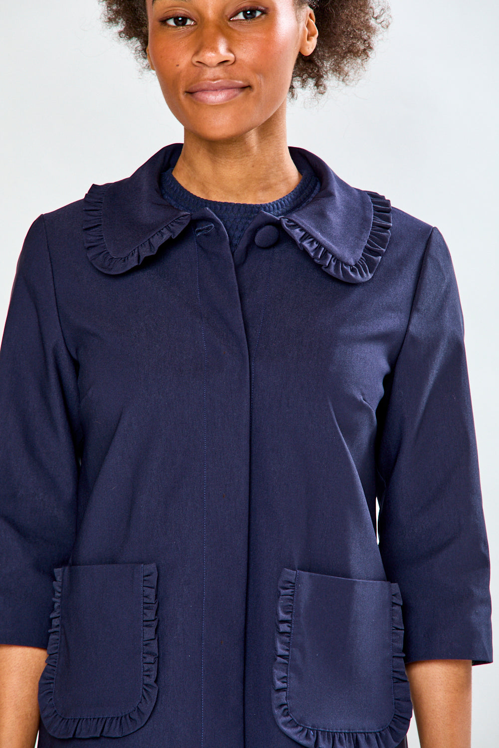 Woman in navy jacket