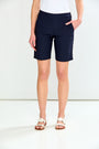 Person wearing navy blue shorts on a white background