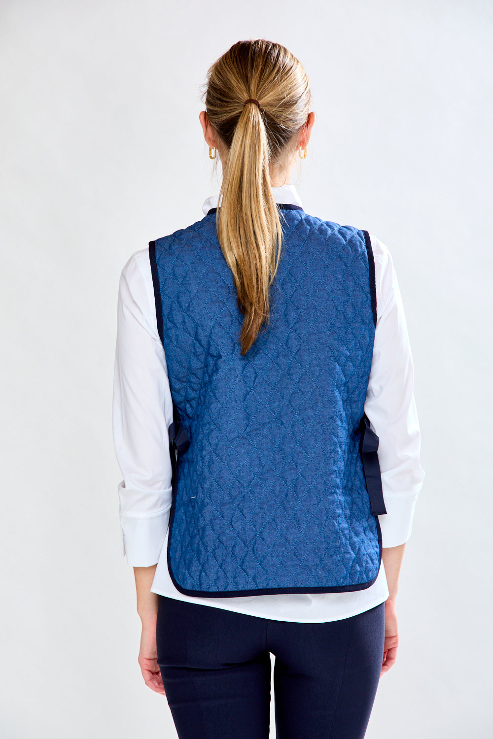 Woman in quilted vest