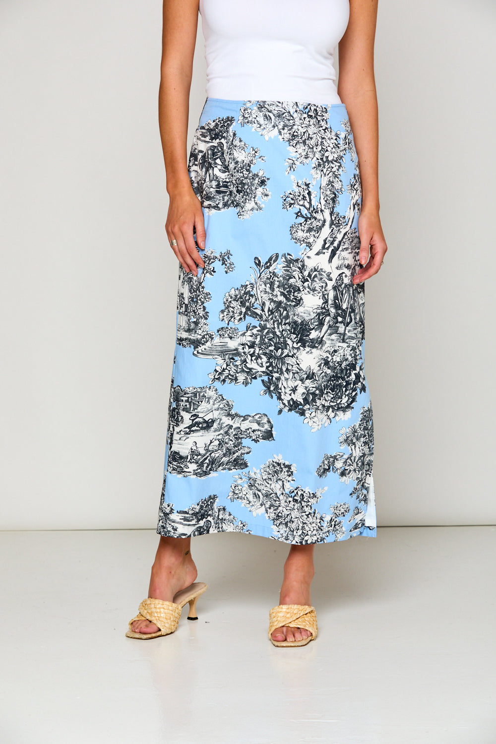 Woman in blue toile skirt