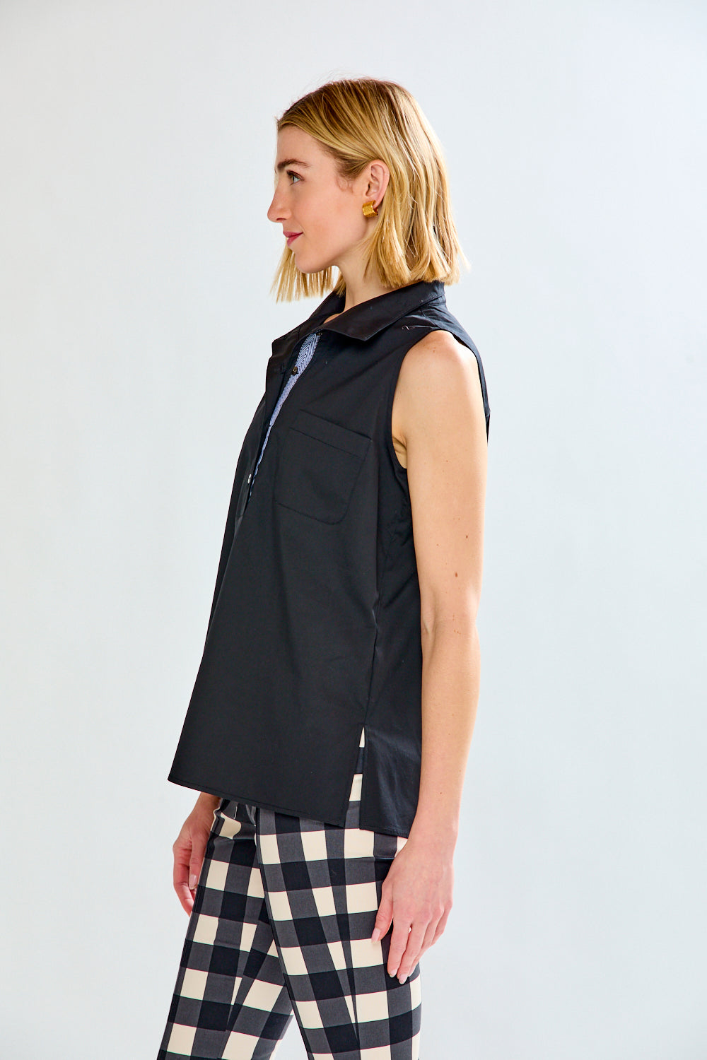 Woman in black sleeveless top