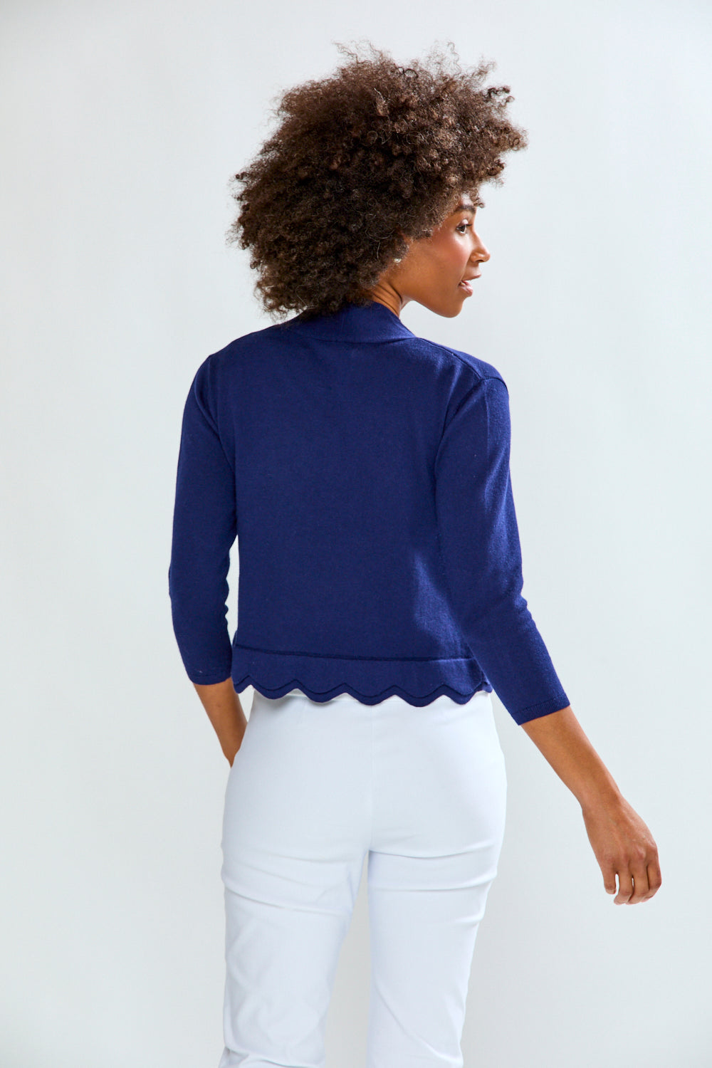 Woman wearing The New Scallop Cardigan - Navy