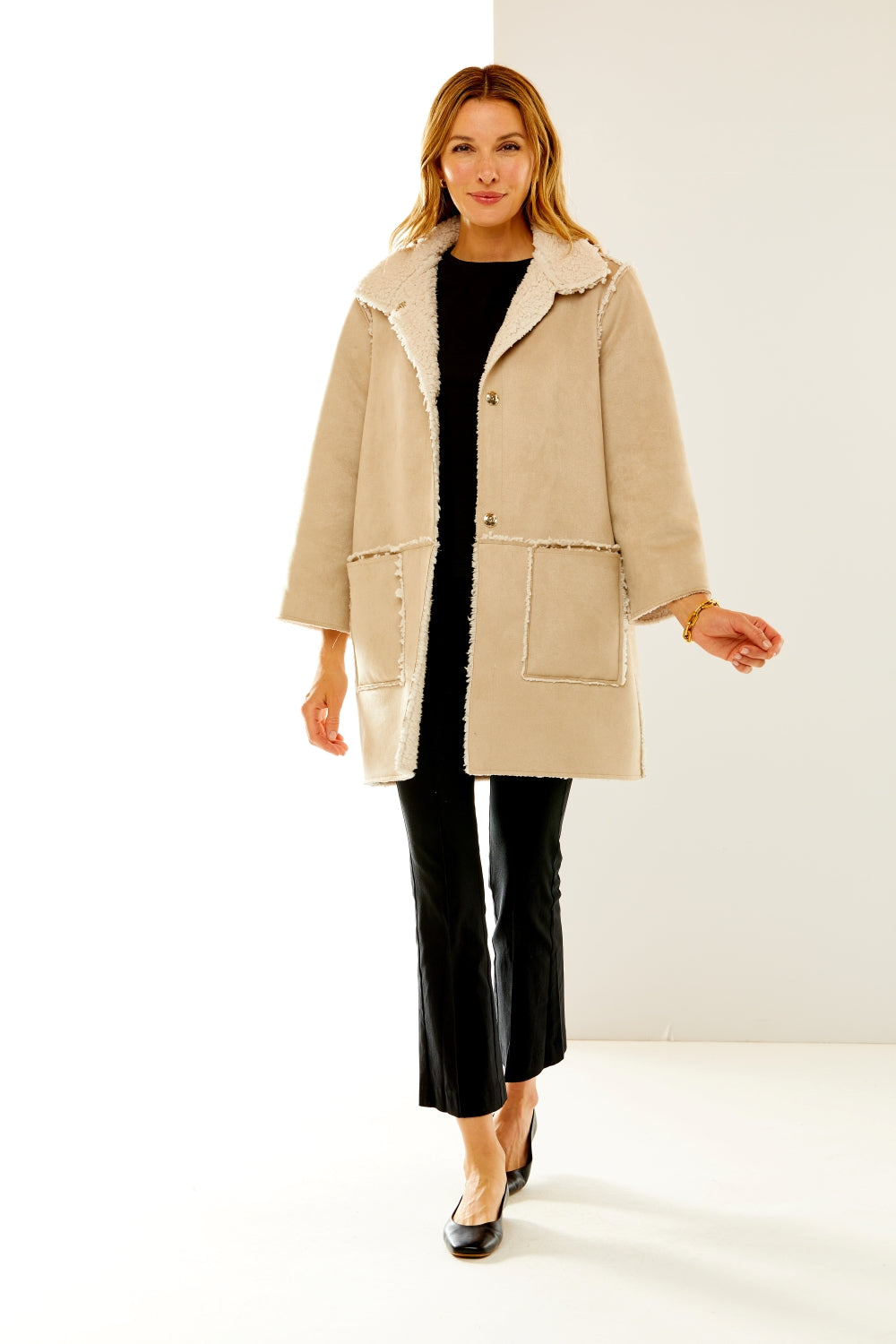 Woman in suede and shearling coat