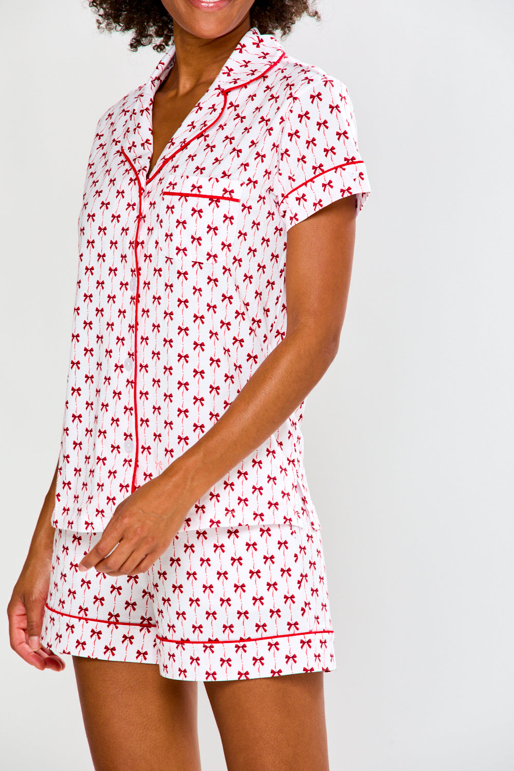 Woman in bow printed pajamas