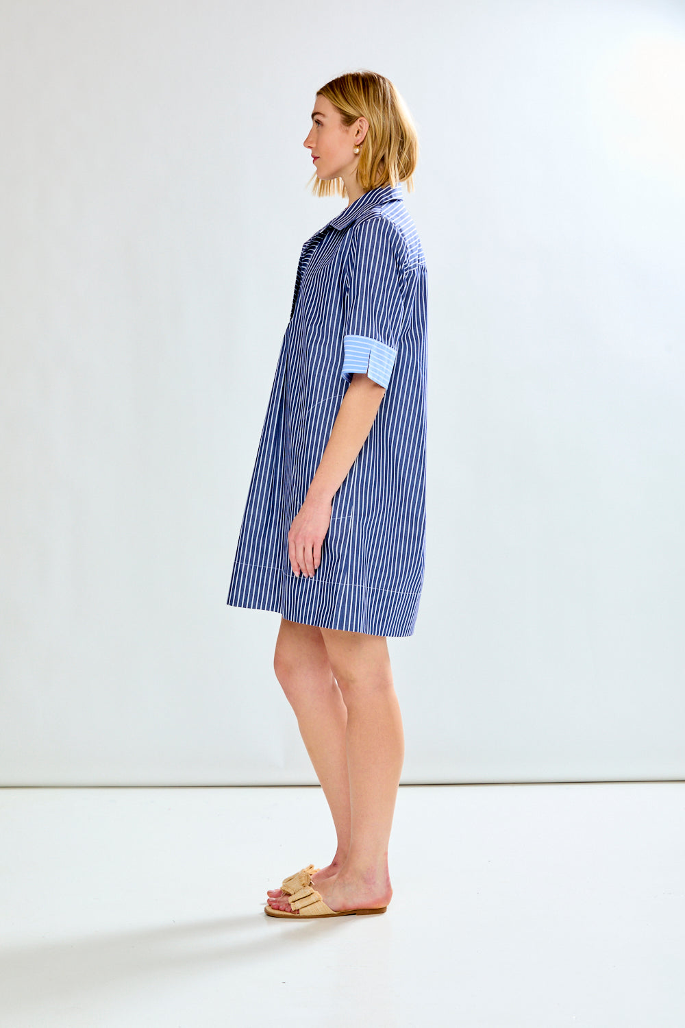 Woman in blue striped dress
