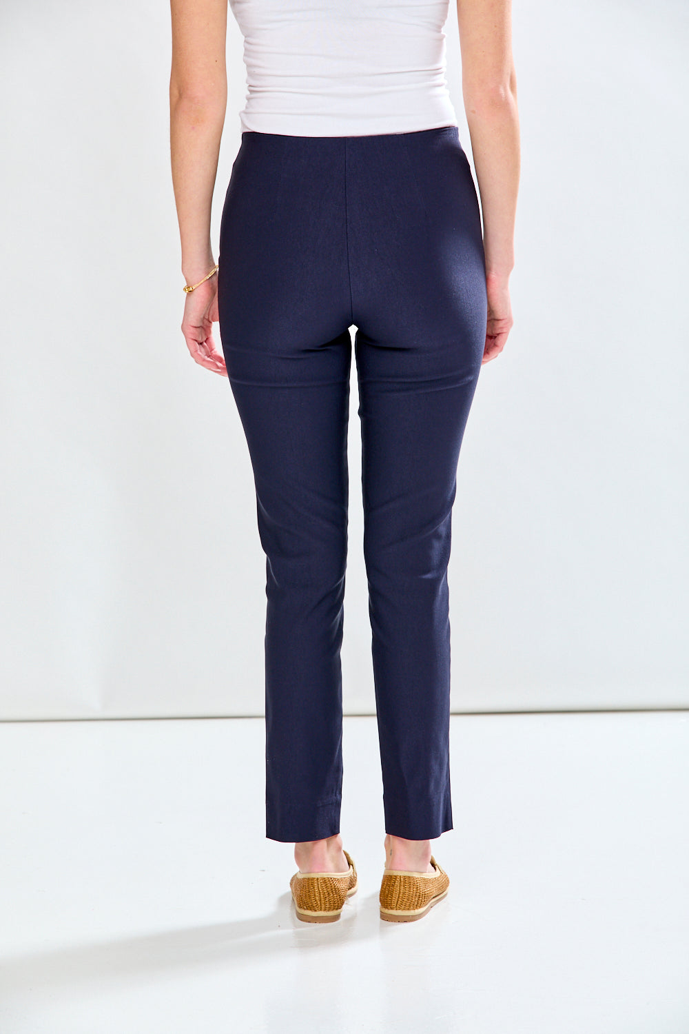 Woman in navy fitted pant