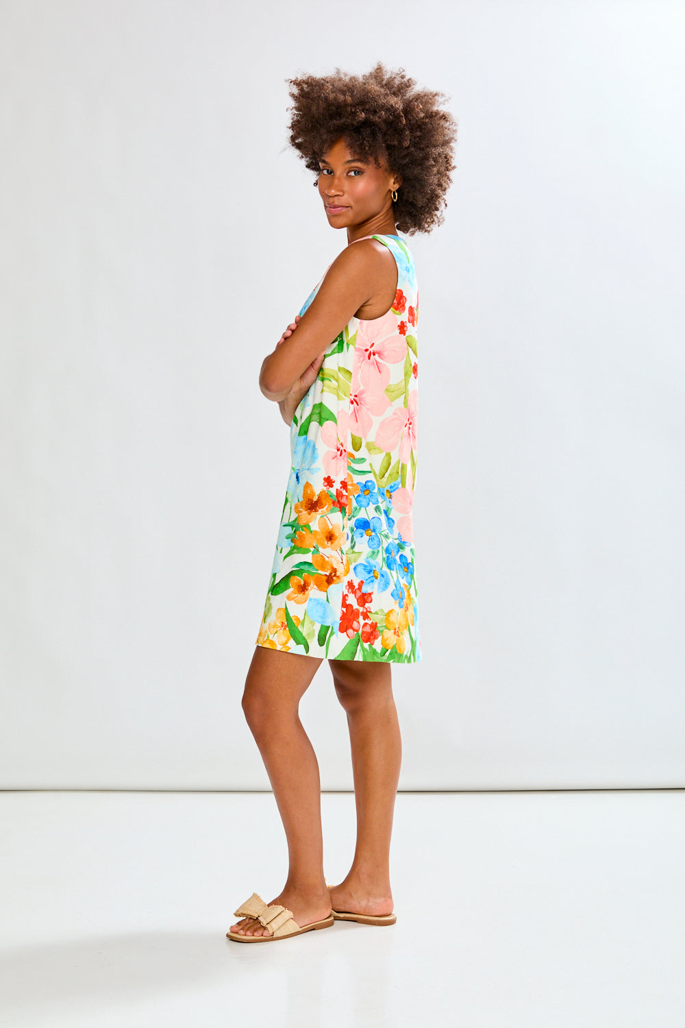 Woman wearing The Sleeveless Rue Dress in Tropical Blooms