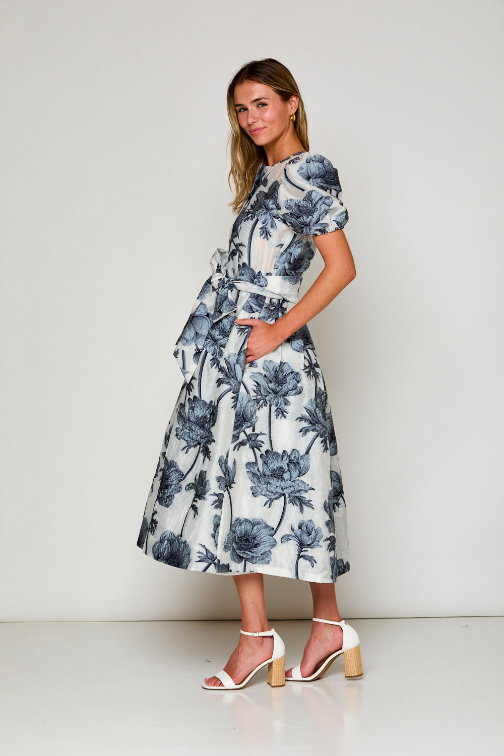 Woman in blue floral dress