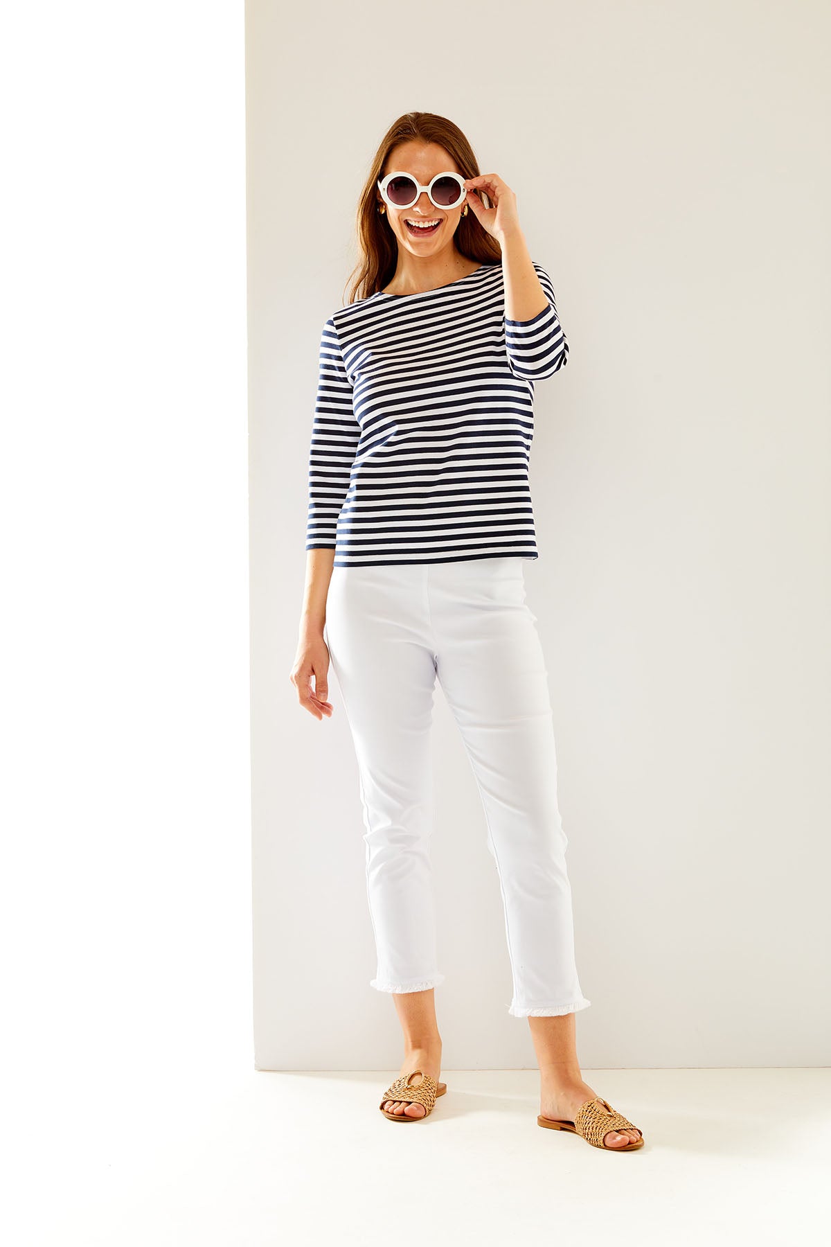 Woman in navy/white stripe top