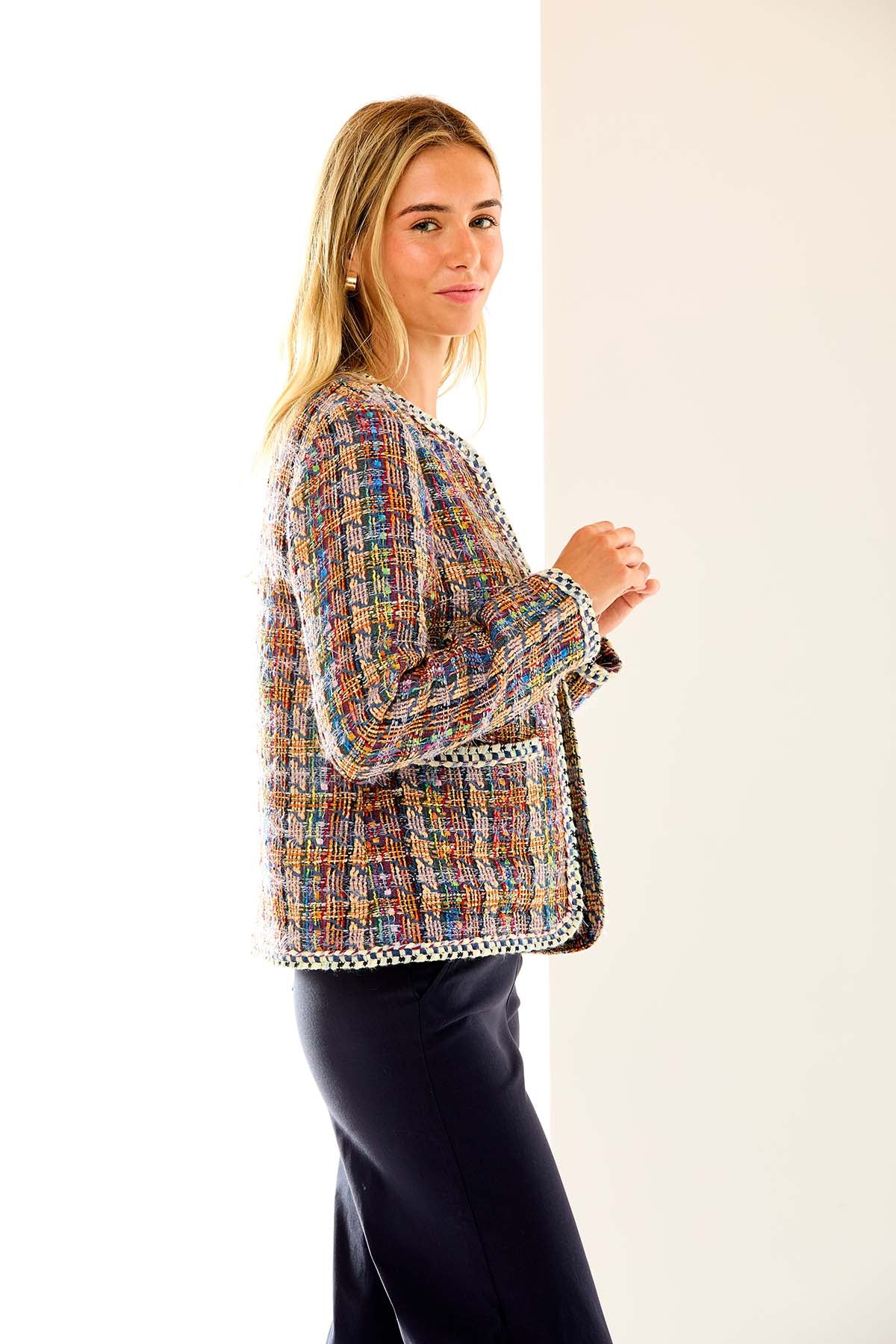 Woman in multi tweed jacket