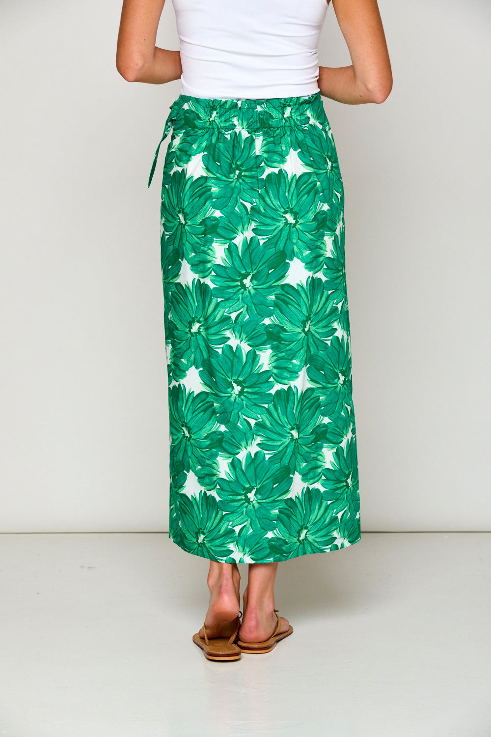 Woman in tropical print skirt