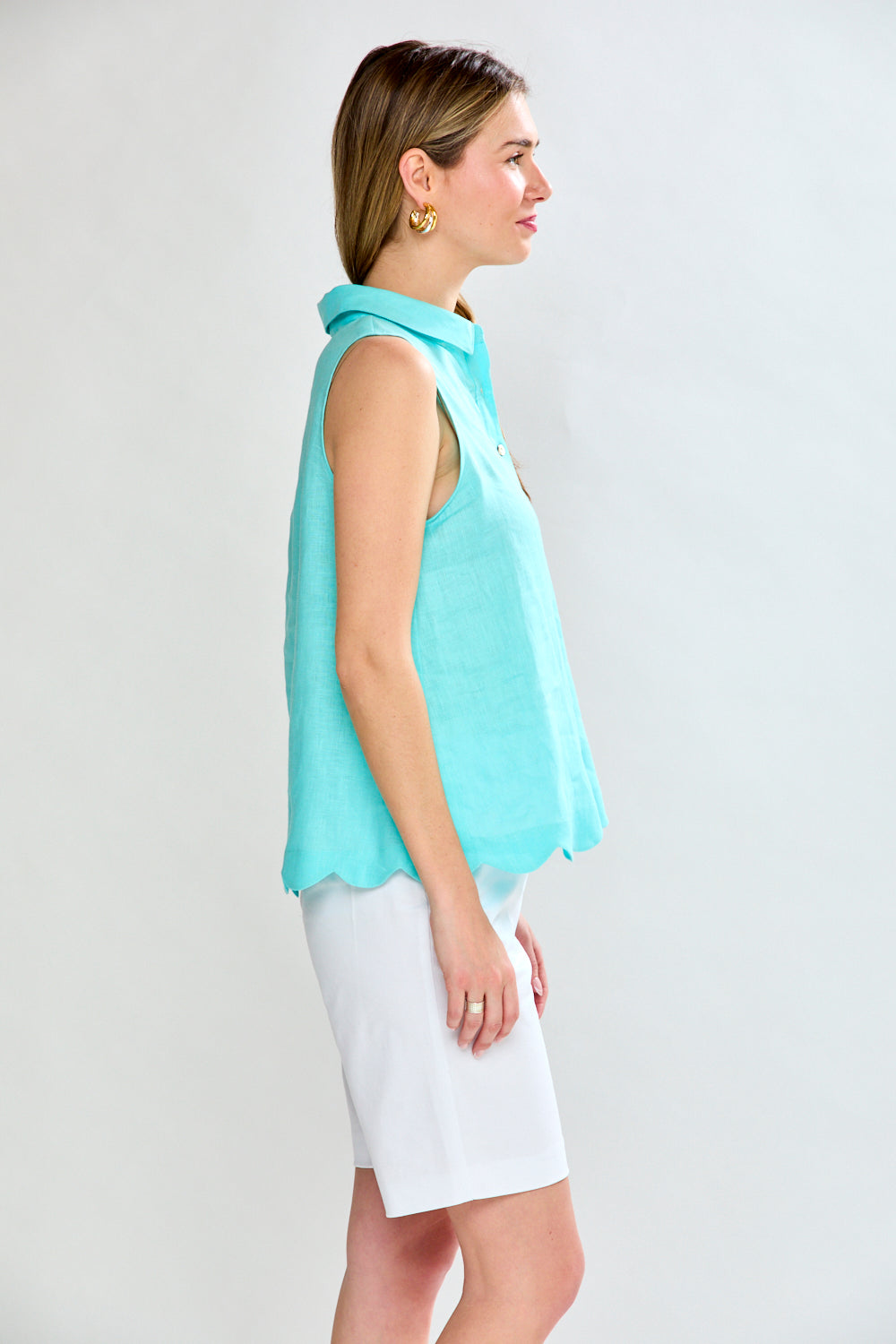 Woman in aero blue sleeveless blouse