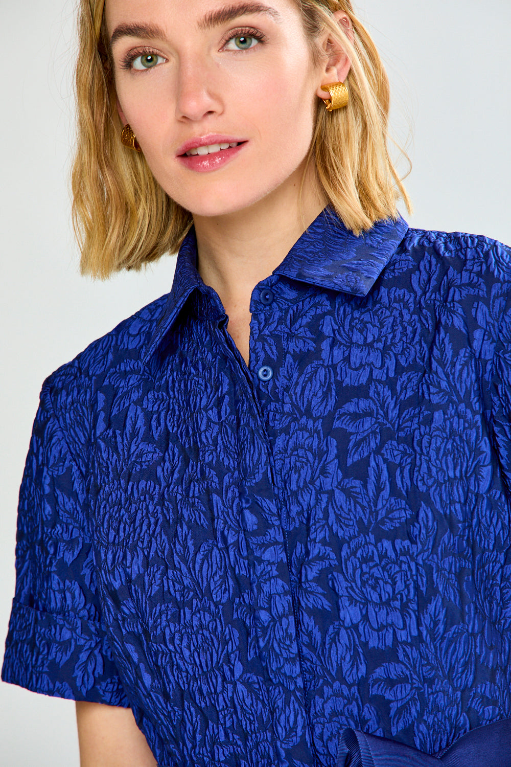 Woman in blue dress with bow