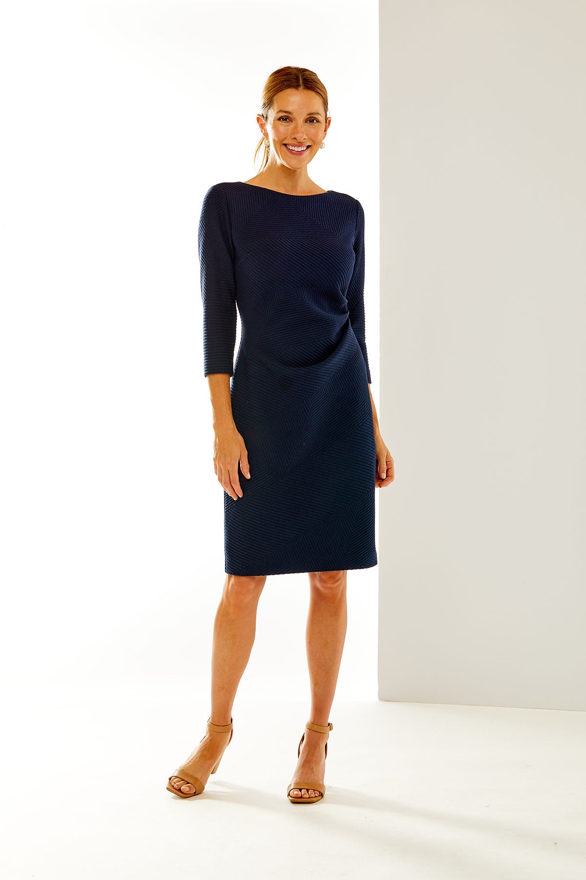 Woman in navy cocktail dress