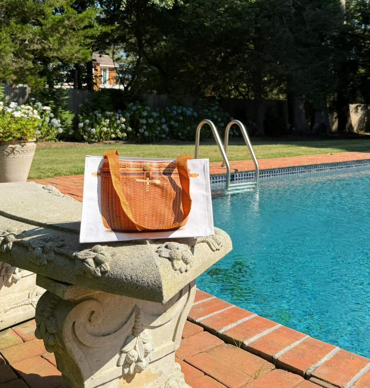 Wicker handbag with a textured white bag on a white background