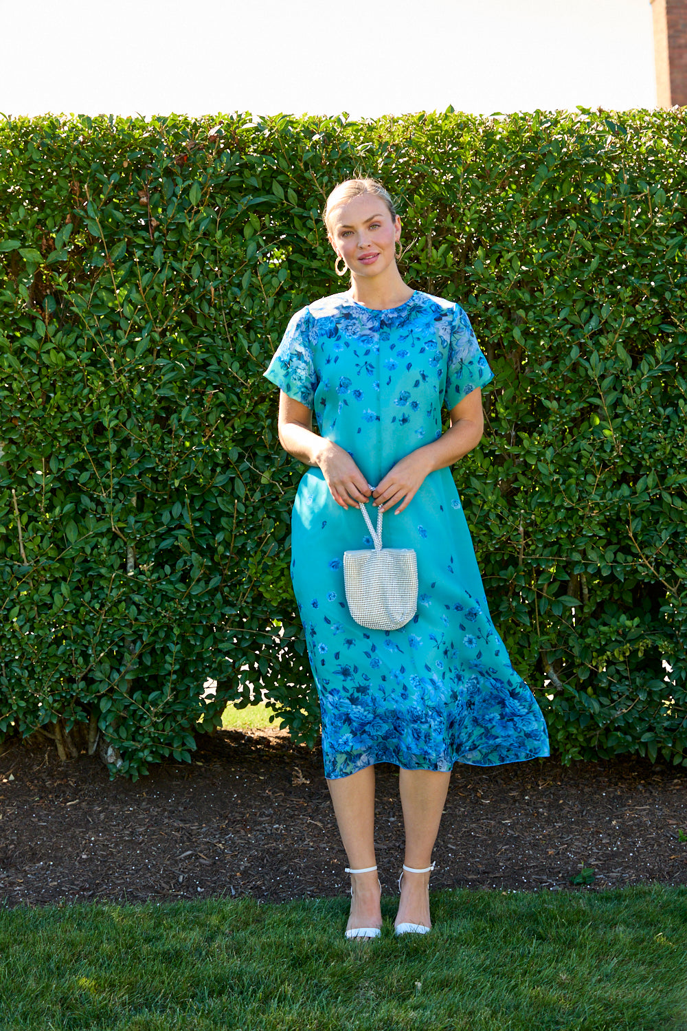 Woman wearing a blue floral dress 