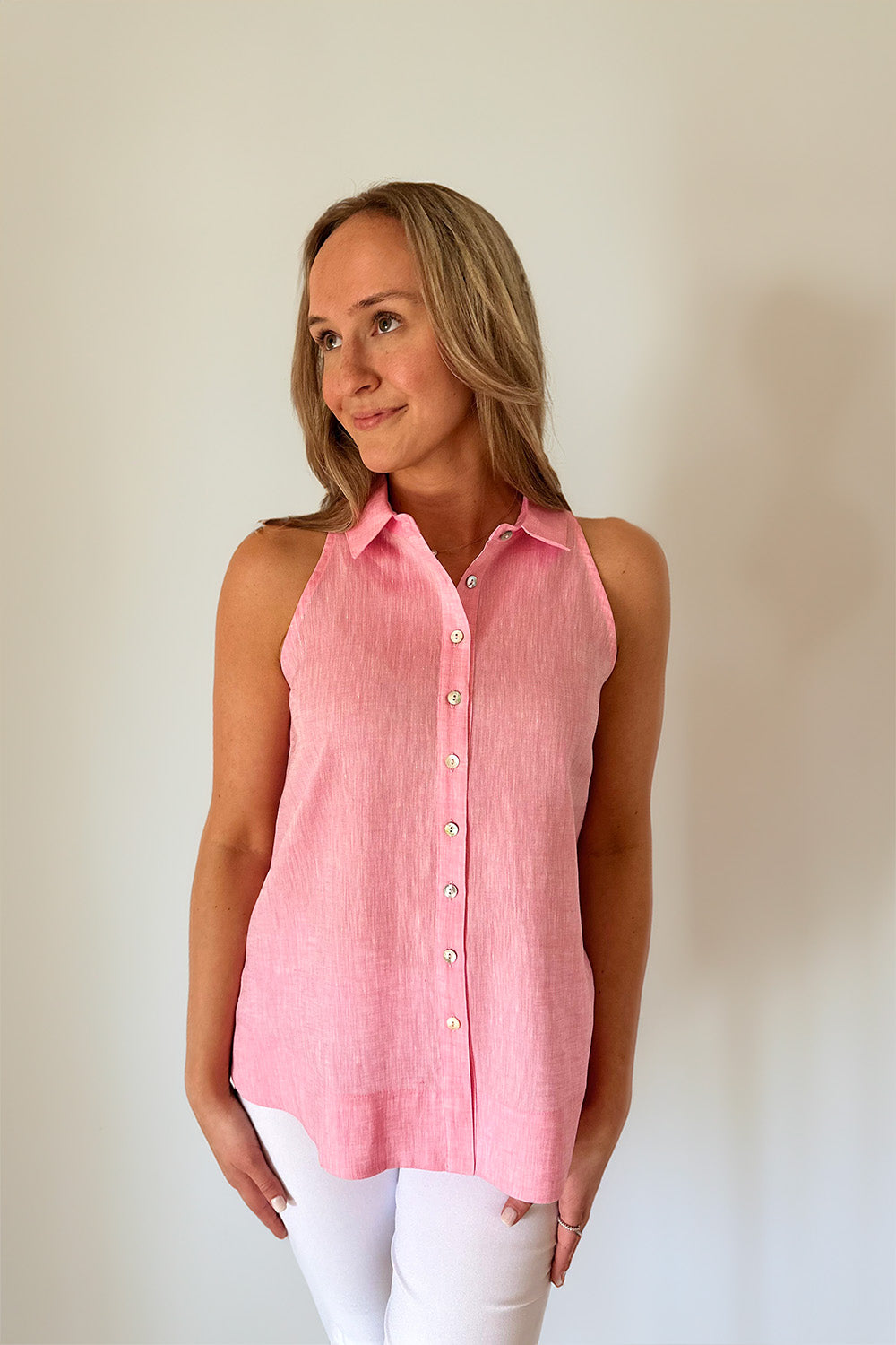 Woman in sleeveless button down top