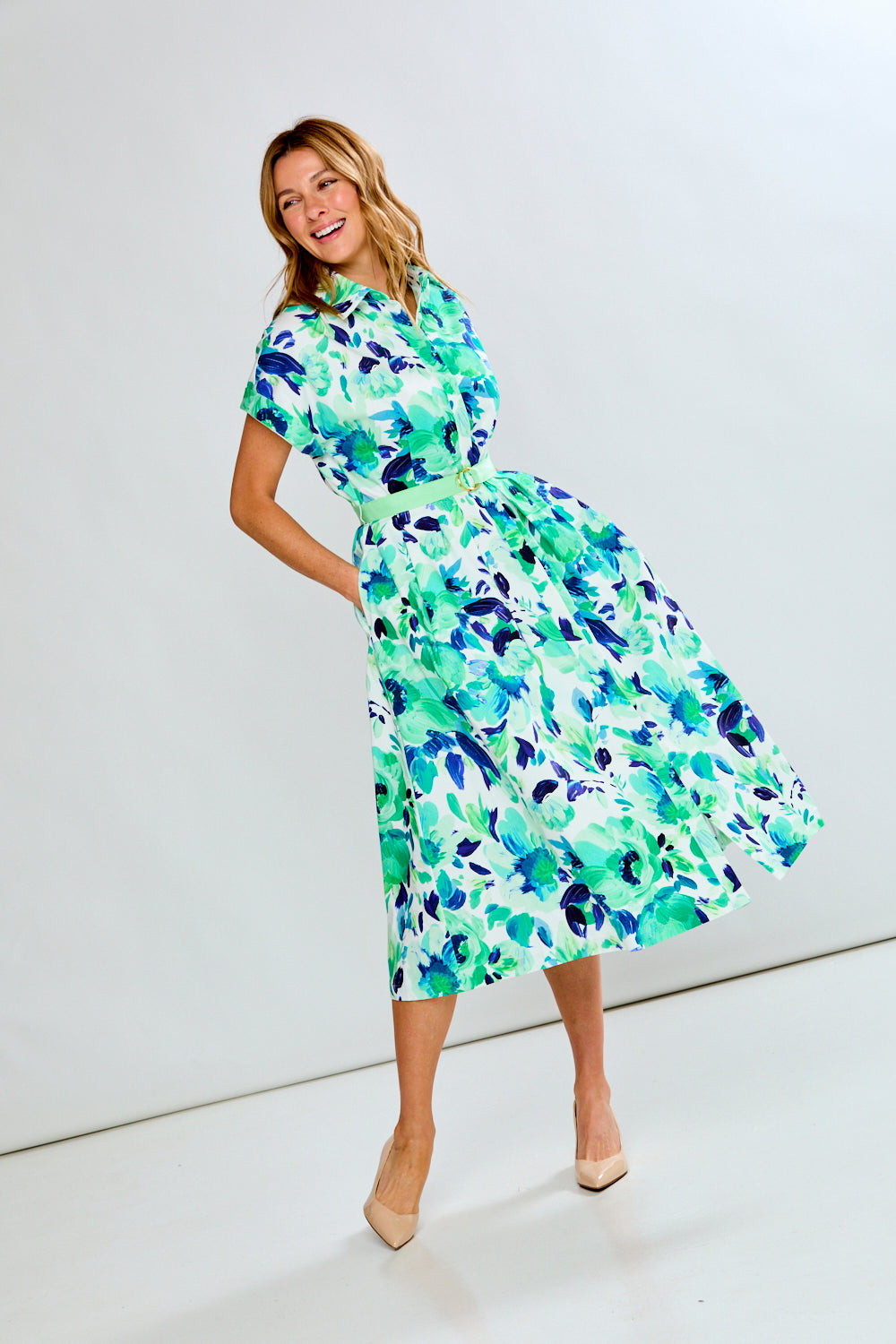 woman in green floral dress