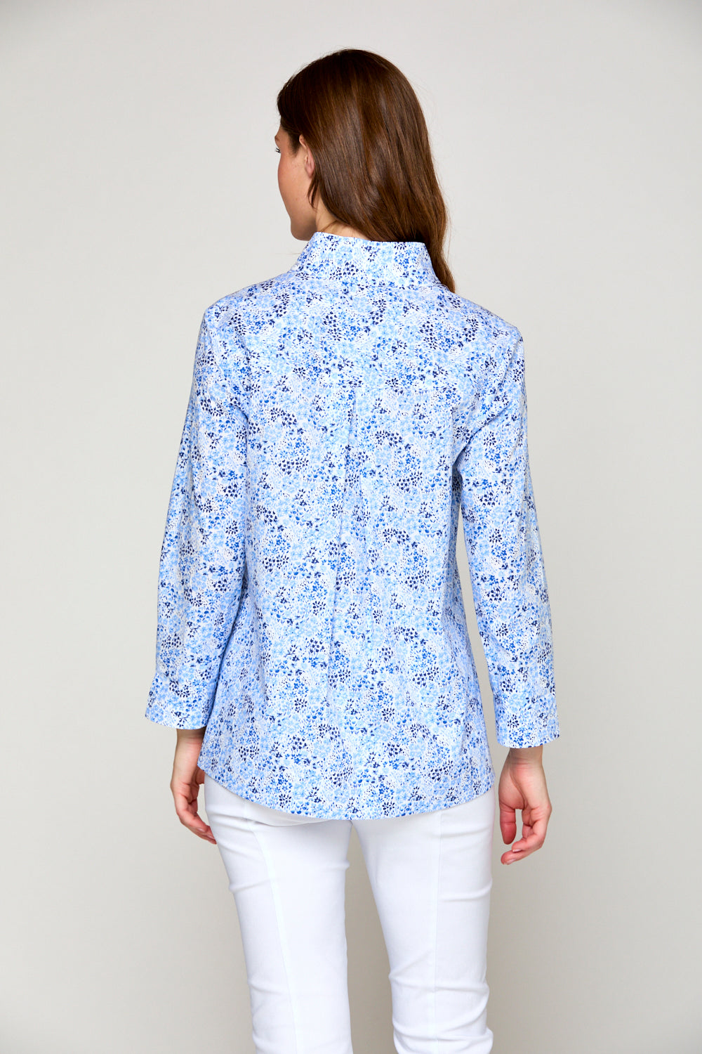 Woman in blue floral top