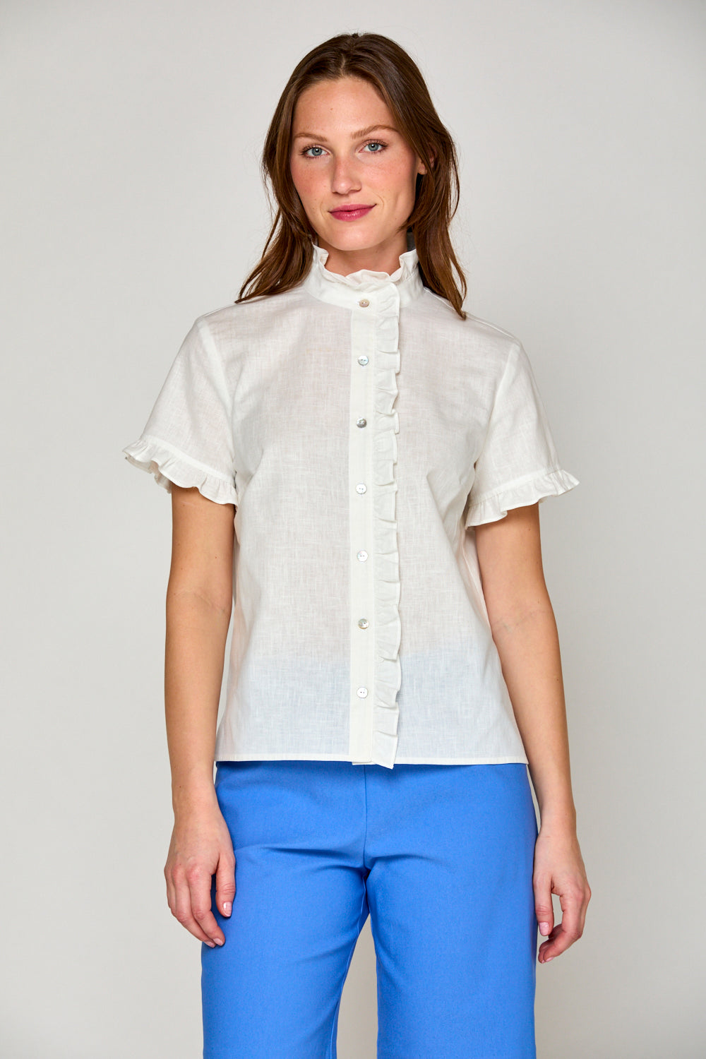 Woman in white short sleeve linen blouse