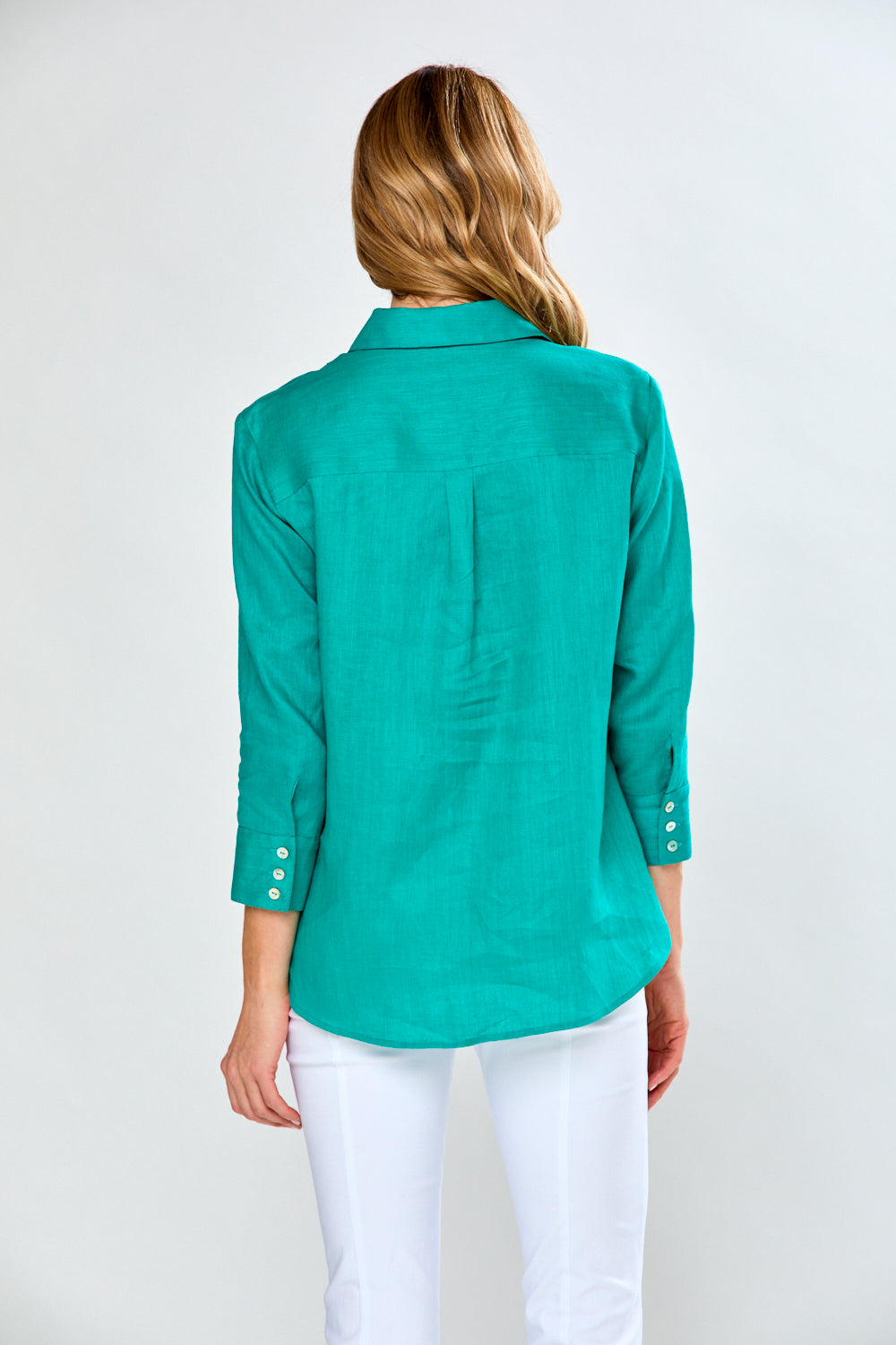 Woman in teal blouse