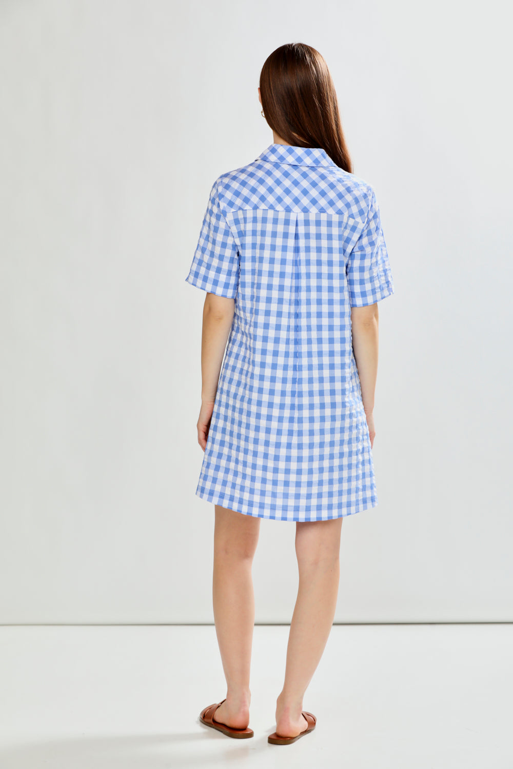 woman in check dress