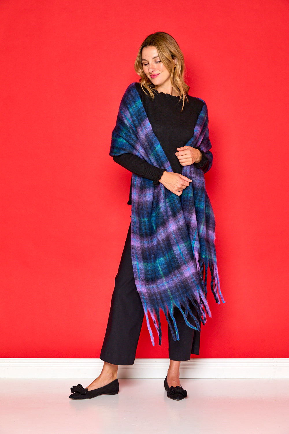 Woman in navy blanket scarf