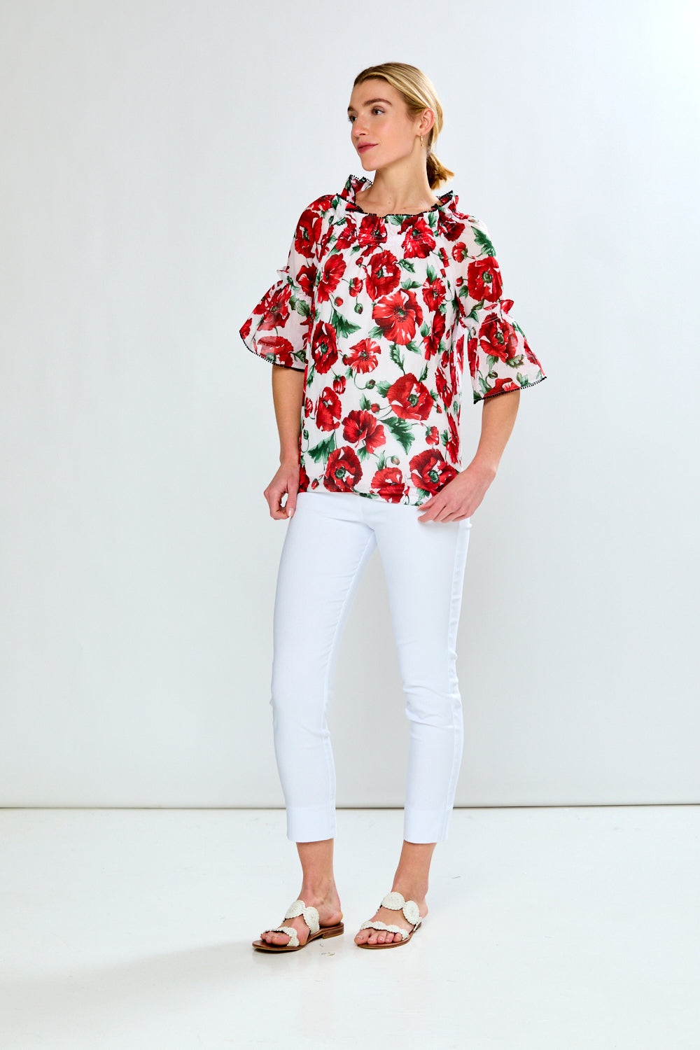 Women in floral red top with black trim