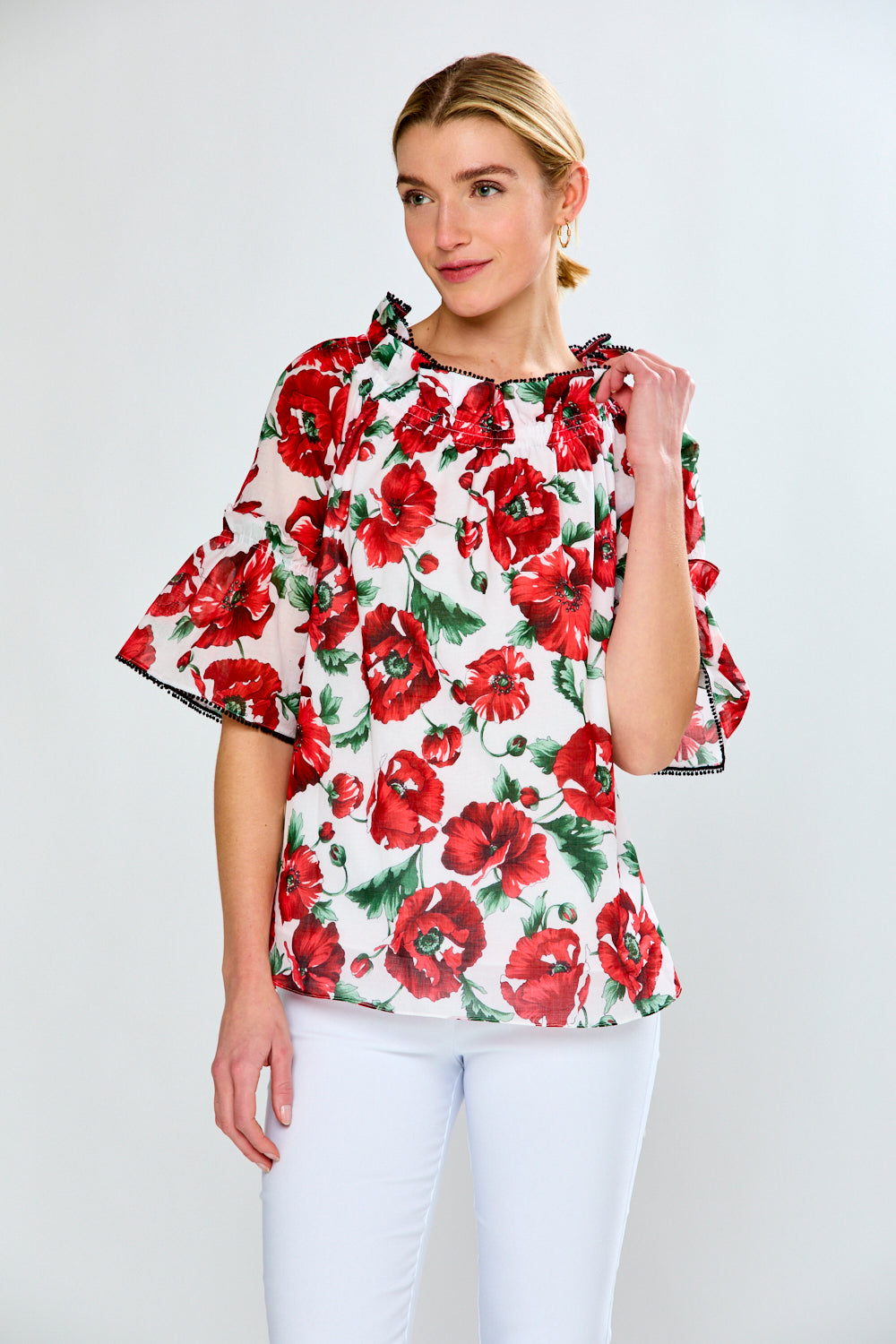 Women in floral red top with black trim