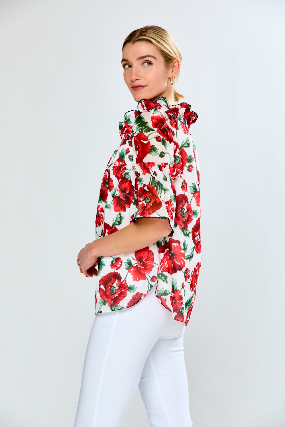 Women in floral red top with black trim